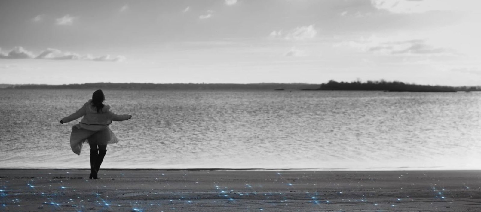 a woman dances on a beach in the film nyctophobia